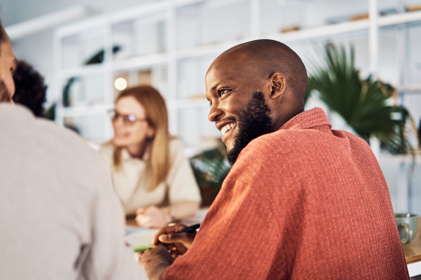Colleagues talking at a table