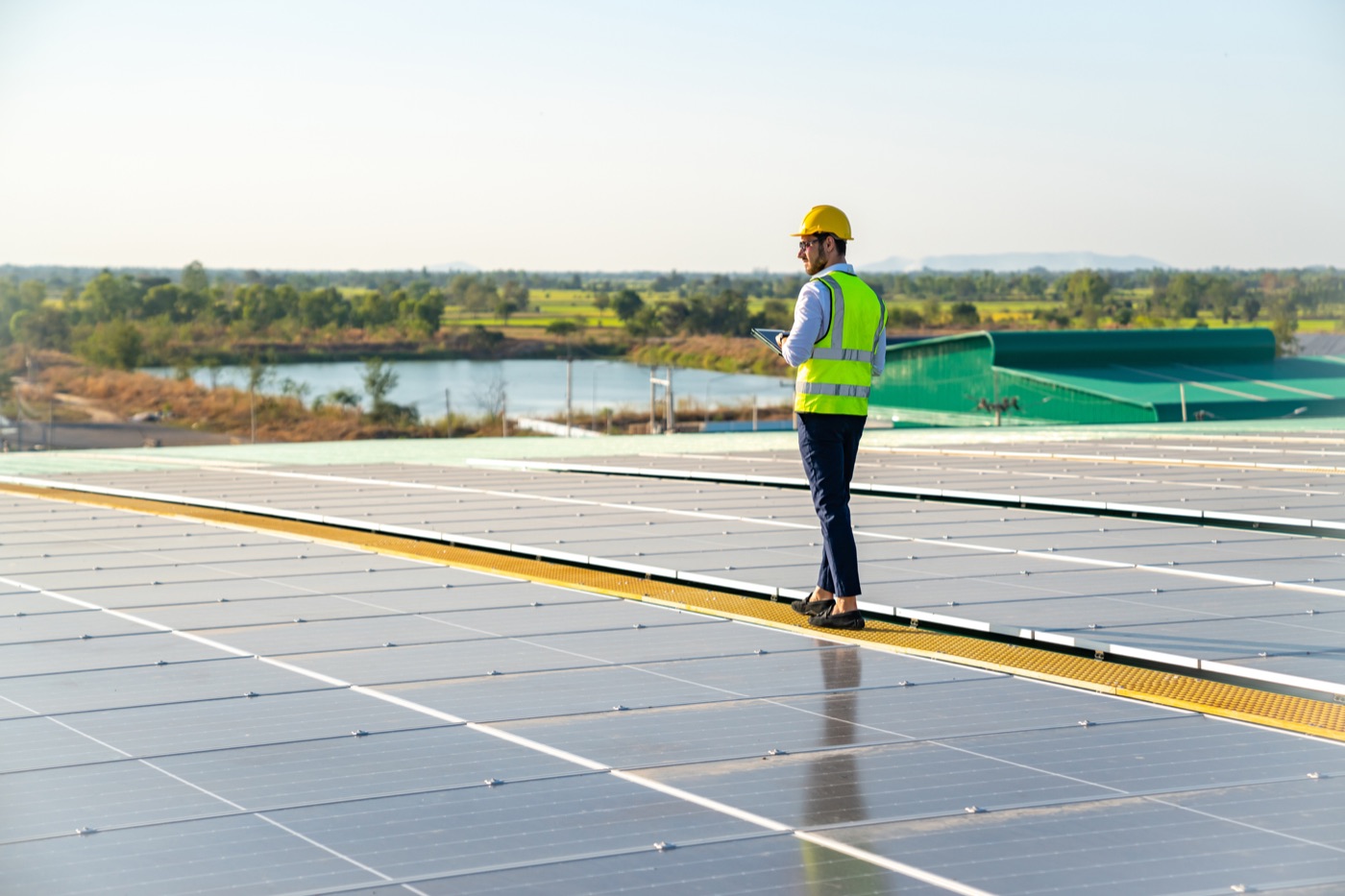 Worker walking across a solar array