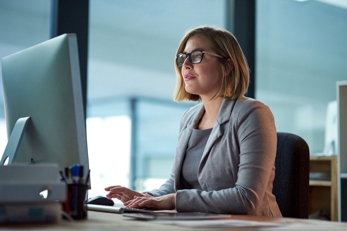 Woman working at a desktop computer